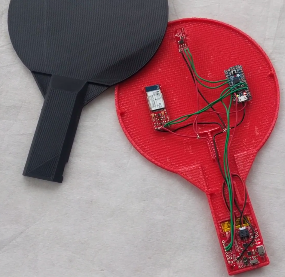 The 3D printed racket with the IMU, MCU and battery management systems